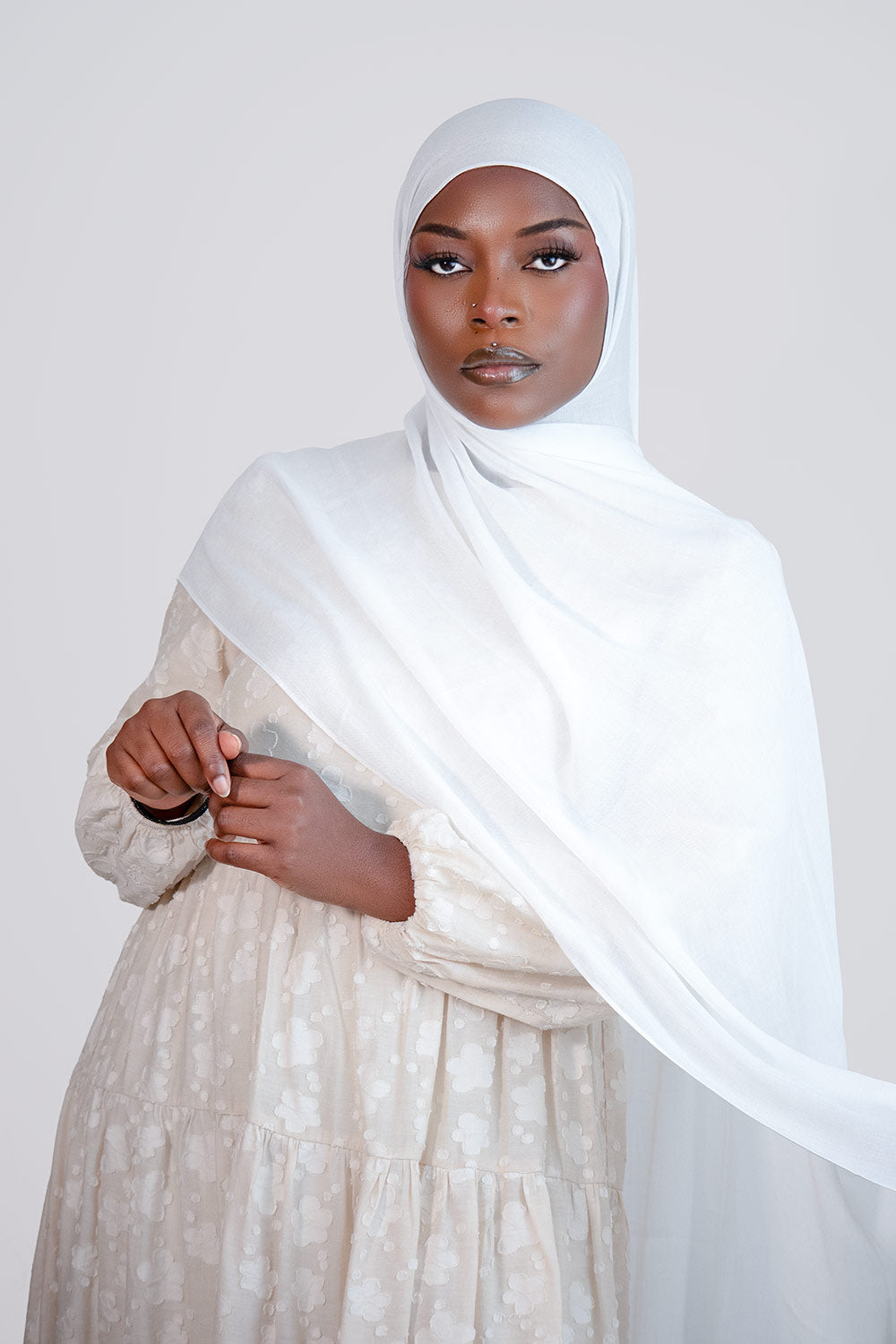 Woman wearing a white  modal hijab 