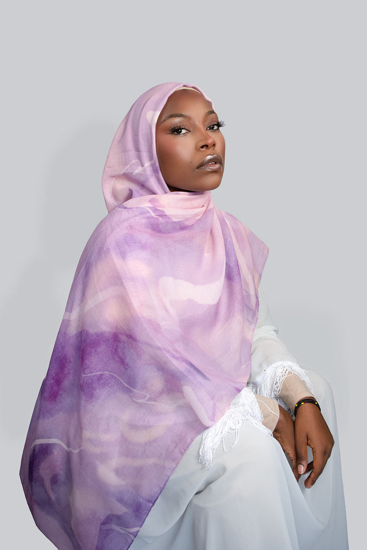 a woman is wearing Purple hijabs
