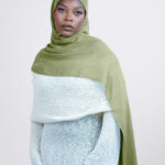 a woman is wearing olive green modal hijab