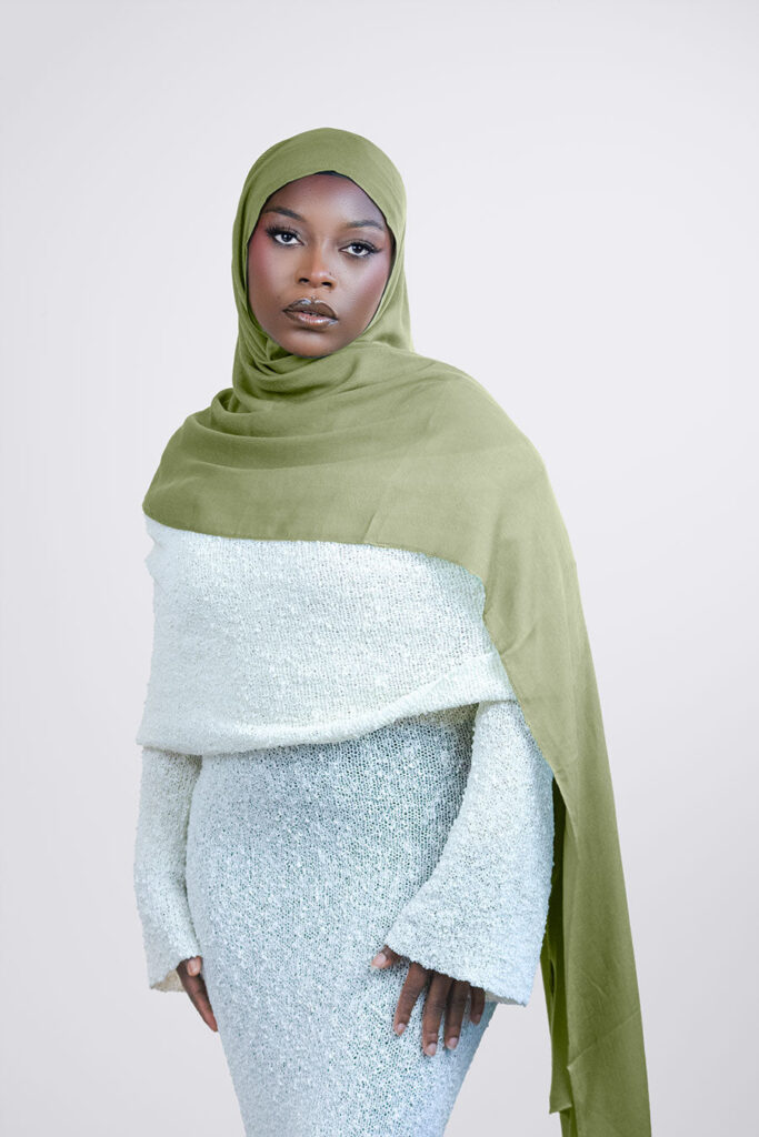a woman is wearing olive green modal hijab