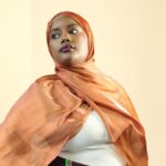 A woman is wearing silk hijab