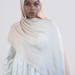 Woman wearing a beige modal hijab
