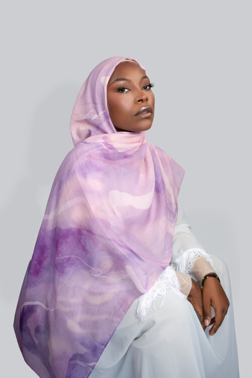 a woman is wearing Purple hijabs